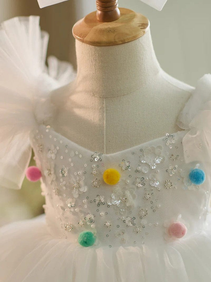 Sunnypetal White Sequins Puffy Sleeves Knee-Length Baby Girl Dresses with Colored Wool Balls